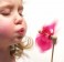 girl blowing pinwheel